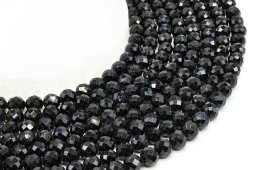 Cuentas facetadas de turmalina negra de 8 mm en un hilo de 38 cm.